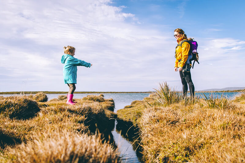 photo of mother and her child divided by a river